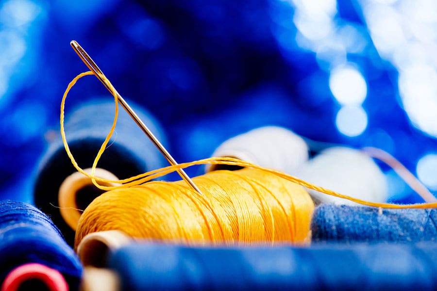Needle and threads shot with foreground and background bokeh