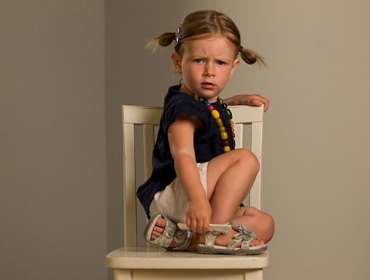 girl sitting on chair