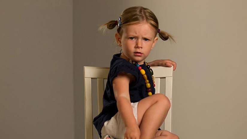 girl sitting on chair