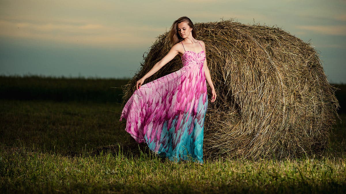 girl teen pink dress hay bale farm