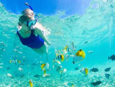 female swimming under water