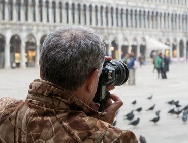 man taking photos outside the building
