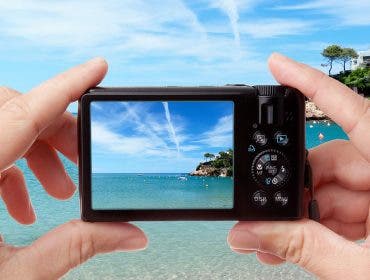 hands holding digital camera