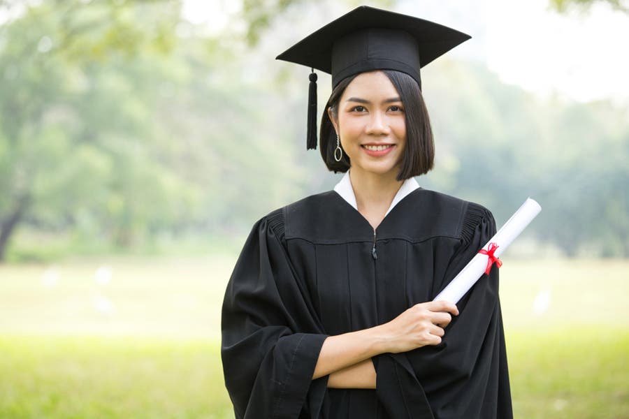 Woman Students wearing Graduation hat and gown