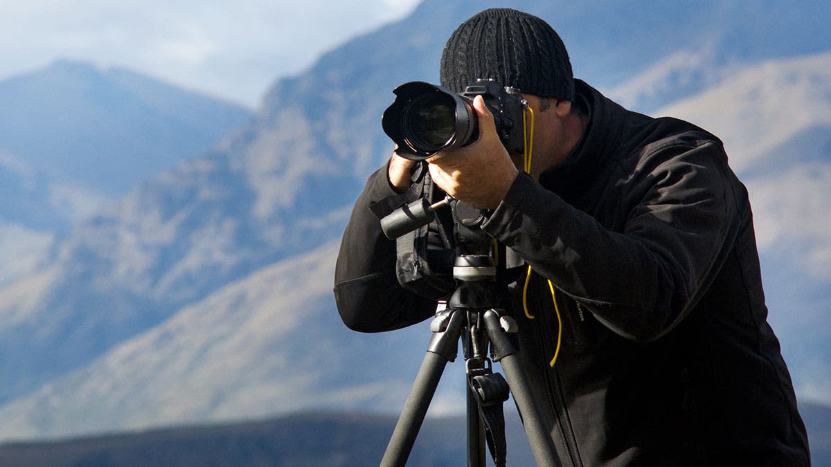 photographer tripod dslr camera