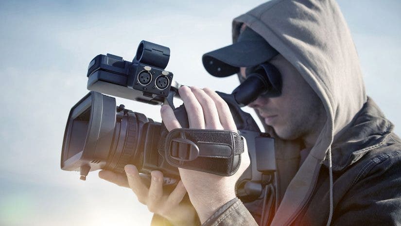 videographer holding camcorder