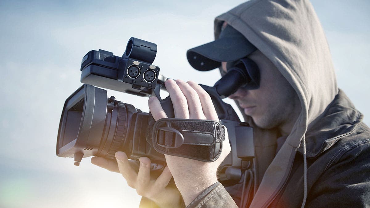 videographer holding camcorder