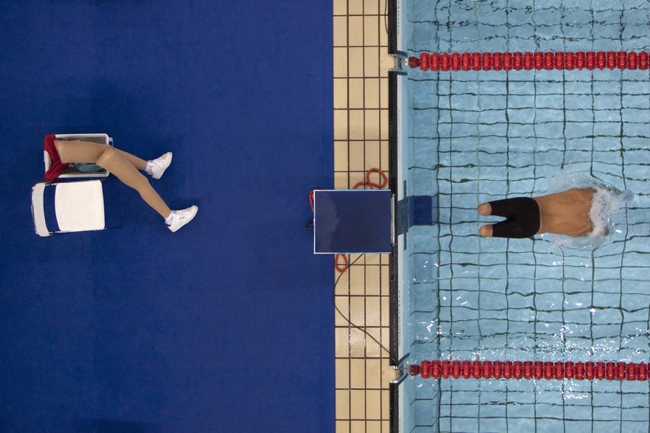 This picture from the 2004. Paralympics in Athens has won more awards than any other photo I have taken, including the highly prestigious World Press Photo of the Year. I was shooting the 200 metres freestyle heats from the catwalk above the water, where the floodlights are fixed, but when the competitors came out for this particular heat there was this one guy in a tracksuit who didn’t have any noticeable disability. Then I saw him start to take his large prosthetic legs off and put them next to his chair and I realised it would make a great picture. But I was half a pool length away so I had to rush over there as quick as I could along all these narrow, rickety catwalks. I didn’t quite make it in time for the start, but luckily for me there was a false start so they had to get out and line up again, which is when I got the shot. The picture had a huge impact all over the world and was widely considered to be the best sports picture of the year.