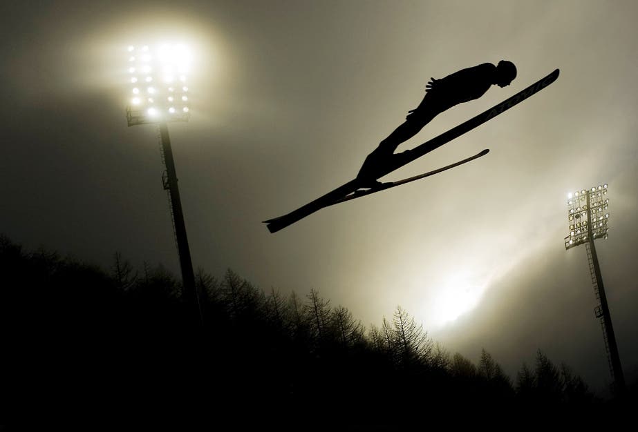 Shot on a D3 with a Nikon 24-70mm f2.8 G AF-S 1/800th at f2.8 400 iso Before the Turin Olympics there was a lot of controversy about the use of floodlights, which had basically been brought in to bring the event times into line with American time zones for television. The photographers were very worried about the lack of light, but in fact it made for some really interesting,contrasting pictures – especially at sunset on one foggy evening for the ski jump." 