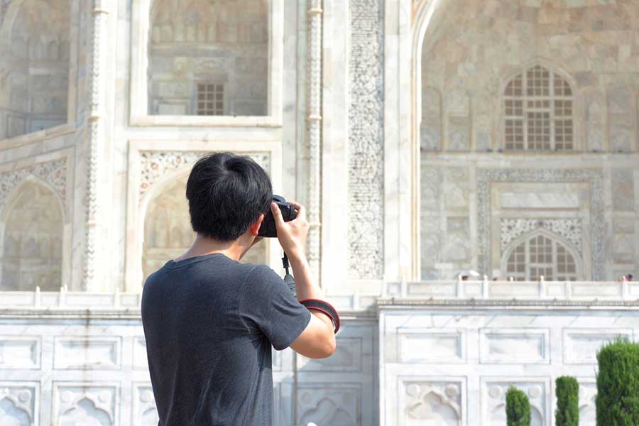 freelance photographer shooting the exterior of the Taj Mahal