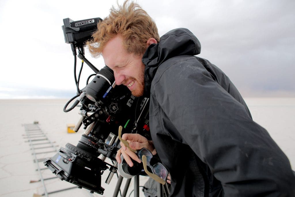 SALERO Cinematographer Andrew David Watson frames up a shot on the Salar de Uyuni. Credit: Nicolas Lindner. Courtesy of Cinereach. © Salero Film LLC. All rights reserved.