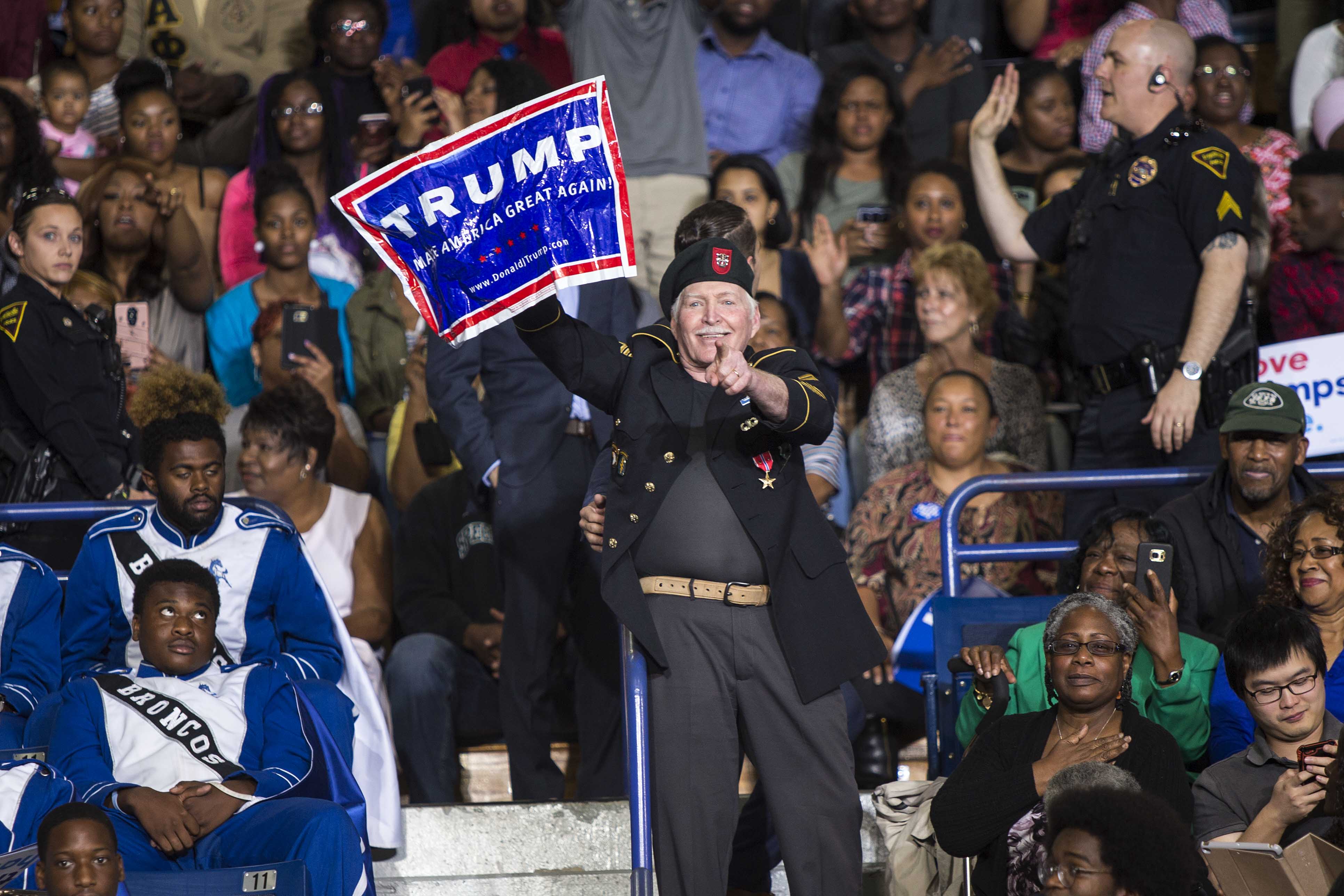 A protestor interrupts President Barack Obama as he speaks during a campaign event for Hillary Clinton at Fayetteville State University, in Fayetteville, N.C., Friday, Nov. 4, 2016. (Al Drago/The New York Times)