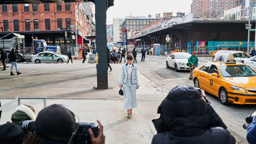 photographers and model on sidewalk in New York City during Fashion Week