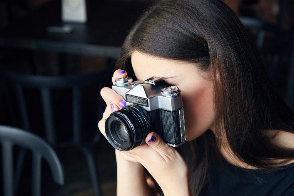 woman holding camera