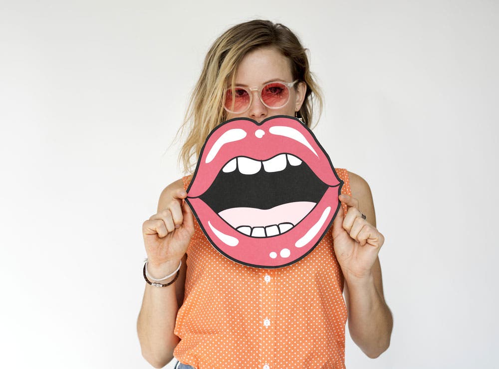 photo of woman with prop mouth cutout