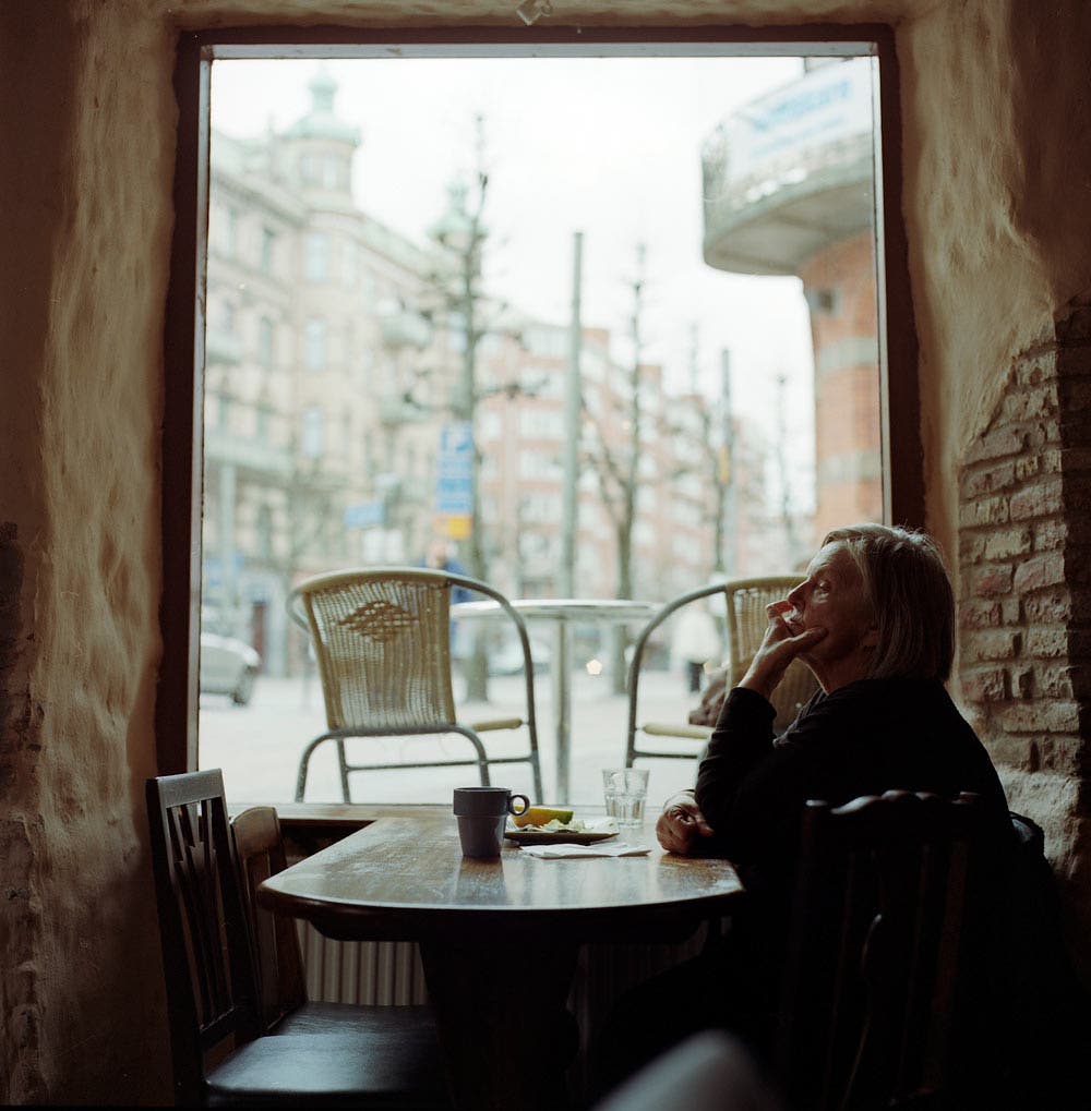 portrait of woman in cafe shot with a medium-format camera