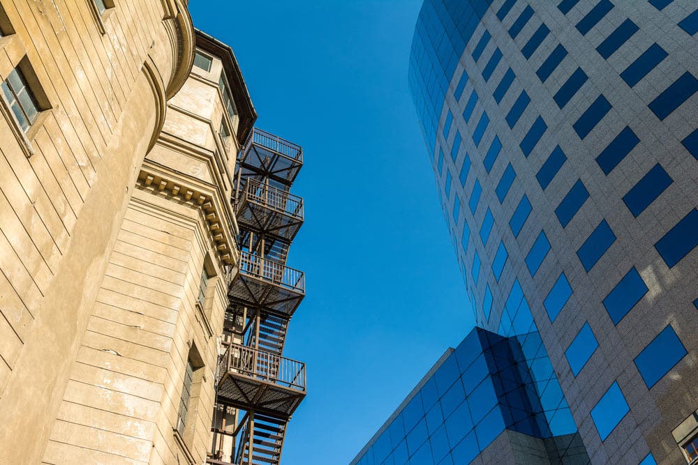 Conceptual Balance in Image Showing Industrialization of Buildings