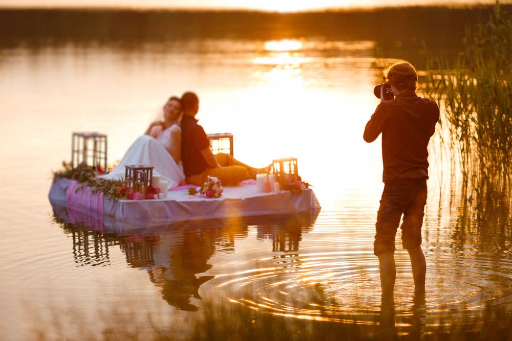 Wedding Photography Shooting Couple on a Raft During Sunset