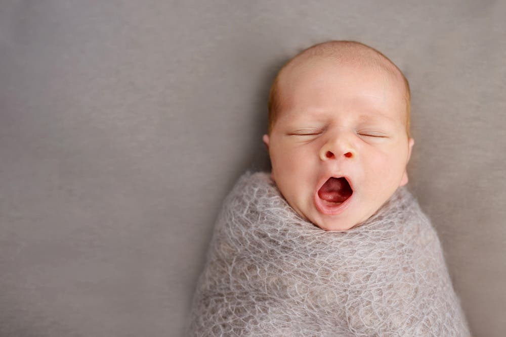 Swaddled Baby Yawning Newborn Baby Photography