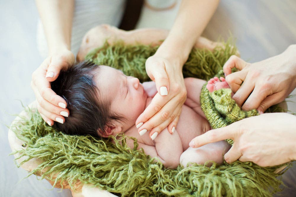 Posing Baby During Newborn Photoshoot