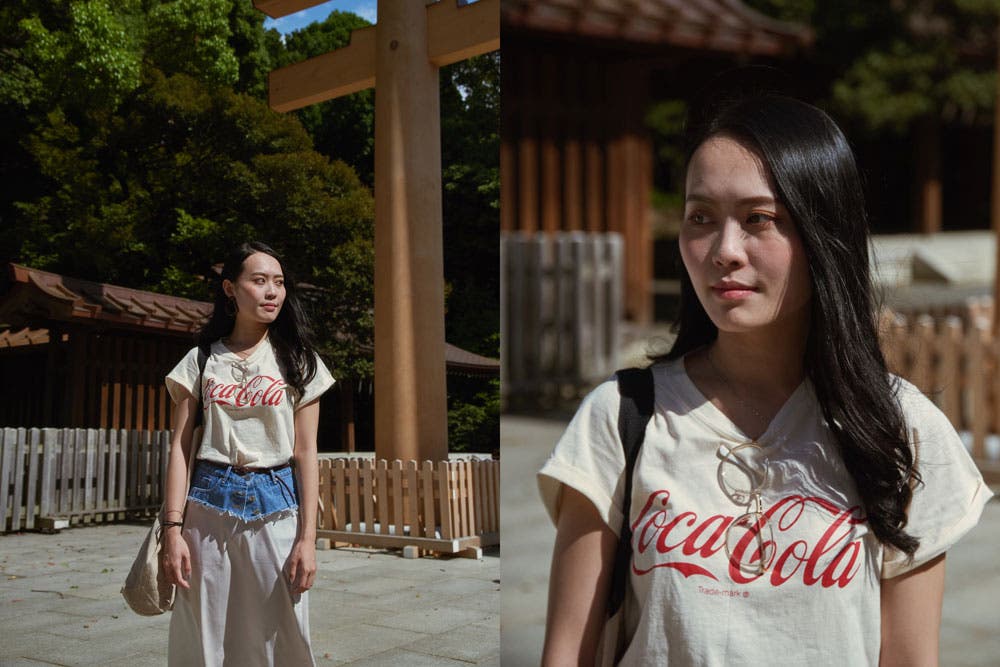 girl wearing coca cola shirt street photography
