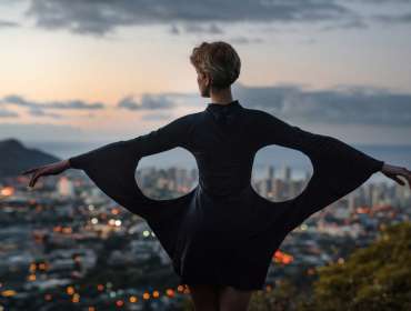 model posing in front of cityscape
