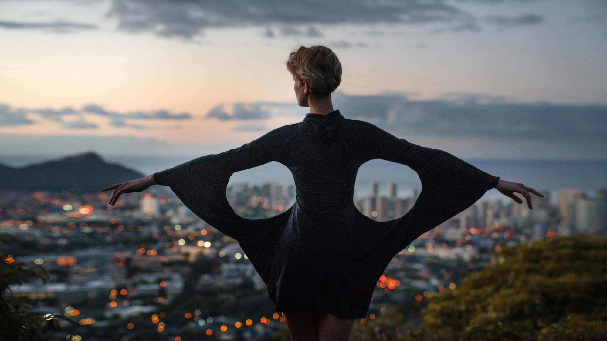 model posing in front of cityscape
