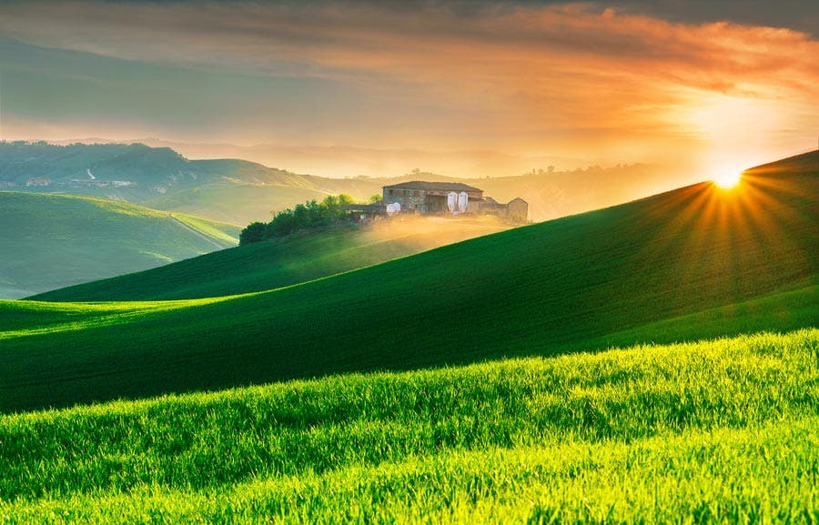 house on green fields travel photography