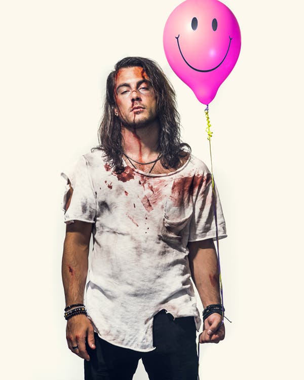 bloody beat up model holding balloon portrait photography