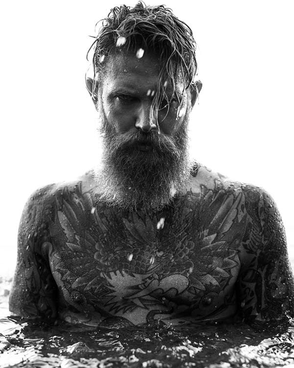 tattooed model portrait with splashing water