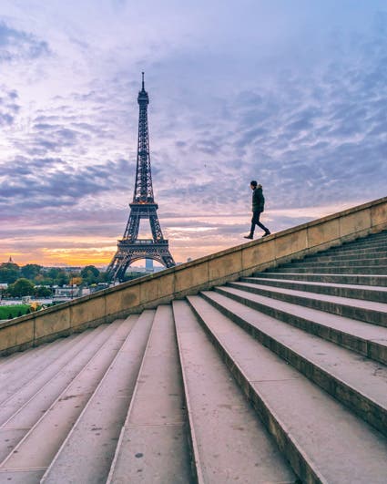 man walking down stairs eiffel tower