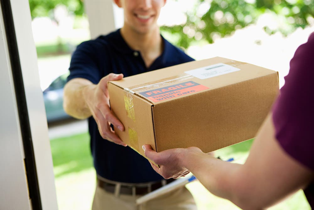 Shipper Handing Package to Receiver
