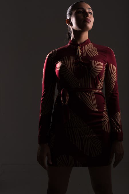 model wearing red suit