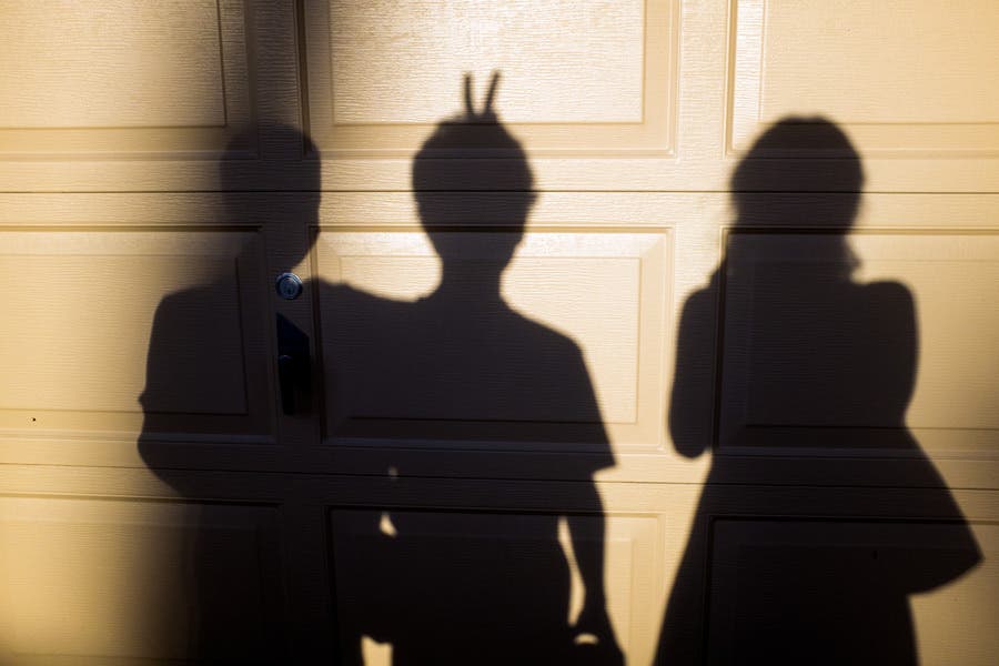 shadows of two boys and a girl