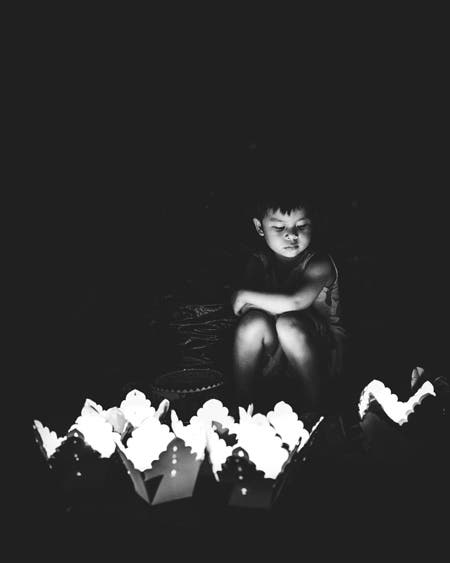 boy looking at lanterns