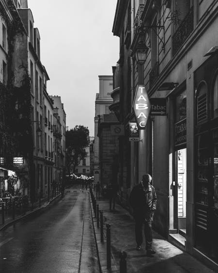 old man walking down street photography