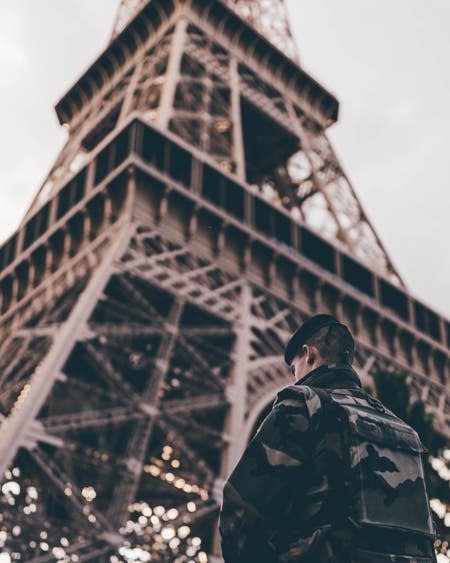 soldier standing by eiffel tower travel photography