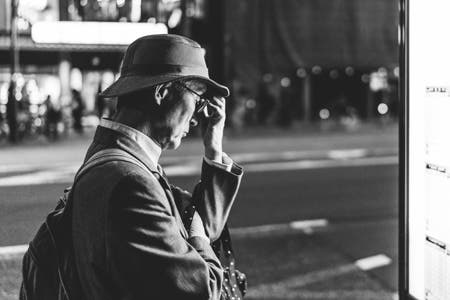 old man thinking street photography
