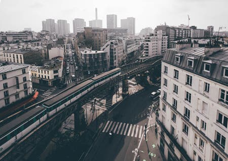 train and buildings street photography