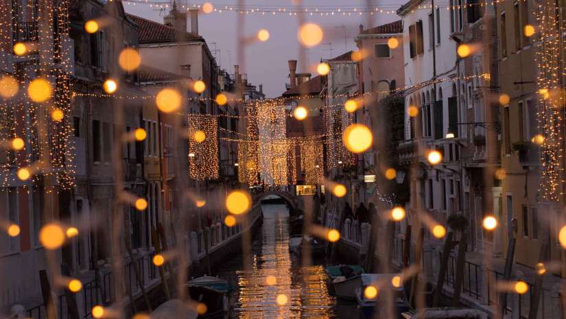 string lights around canal in venice travel photography
