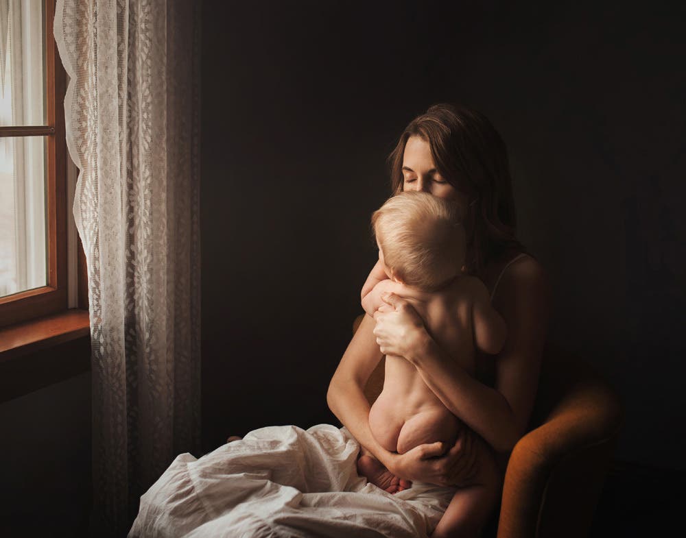 woman hugging her son