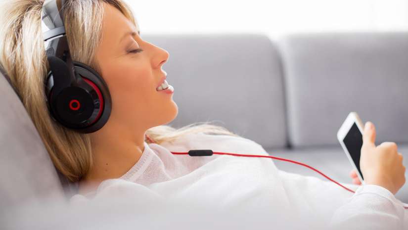Woman listening to music with Beats headphones
