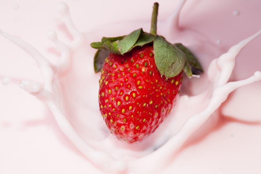 Strawberry splashes on milk