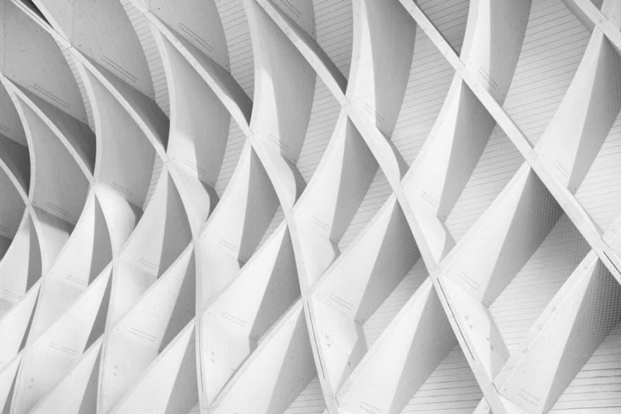 white geometric shapes on building architecture photography
