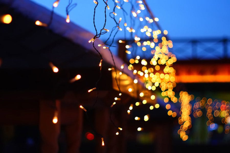 Hanging Christmas lights with bokeh background