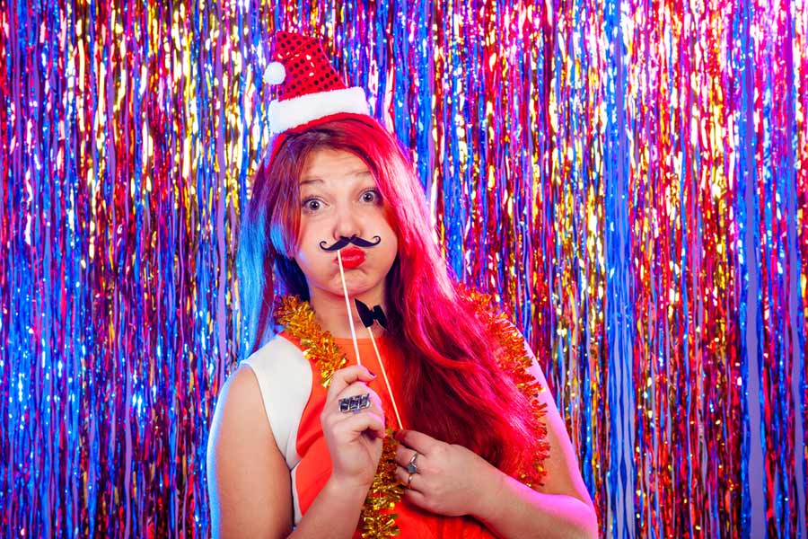 girl having her picture taken at DIY photo booth