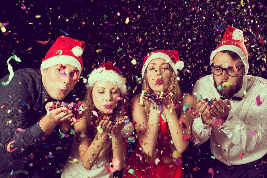 group of friends enjoying DIY photo booth confetti