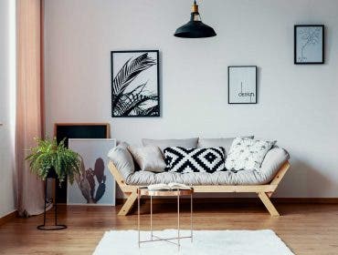 Patterned pillow on scandinavian sofa real estate photo shoot