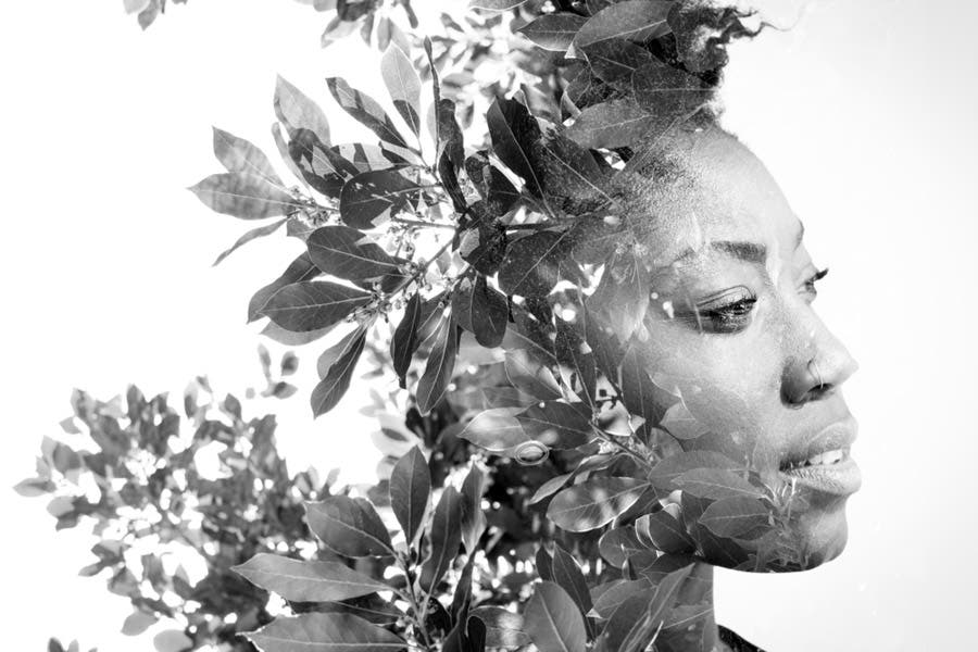 Side-by-side double exposure shot of woman and tree leaves