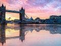 Water reflection of London Tower Bridge at sunset